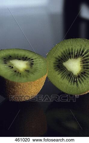 A kiwi fruit cut in half View Large Photo Image Stock Image - A kiwi fruit cut in half. Fotosearch