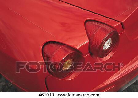 Tail lights on a red sports car View Large Photo Image Stock Photo - Tail lights on a red sports car. Fotosearch