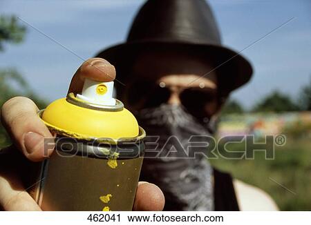 A man holding a can of spray paint View Large Photo Image Stock Image - A man holding a can of spray paint. Fotosearch
