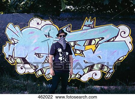 A man standing in front of his graffiti mural View Large Photo Image Stock Image - A man standing in front of his graffiti mural. Fotosearch