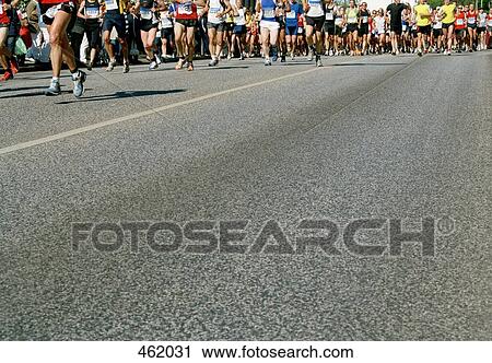 Stock Image - Runners in a marathon. Fotosearch