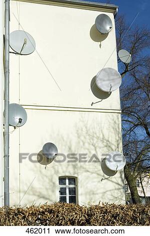 Satellite dishes on the side of a building View Large Photo Image Stock Image - Satellite dishes on the side of a building. Fotosearch