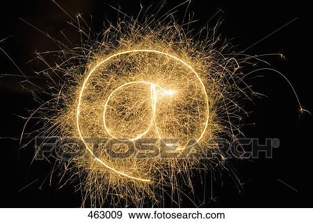 At' Symbol drawn with a sparkler View Large Photo Image Stock Photo - At' Symbol drawn with a sparkler. Fotosearch