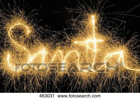 Stock Image - Santa' drawn with a sparkler. Fotosearch