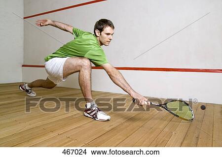 Picture - A man playing squash. Fotosearch