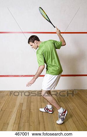 A man playing squash View Large Photo Image Stock Image - A man playing squash. Fotosearch