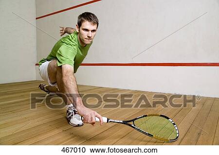 A man playing squash View Large Photo Image Stock Image - A man playing squash. Fotosearch