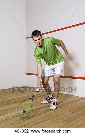A man playing squash View Large Photo Image Stock Image - A man playing squash. Fotosearch