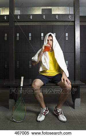 A man resting in a locker room View Large Photo Image Stock Photography - A man resting in a locker room. Fotosearch