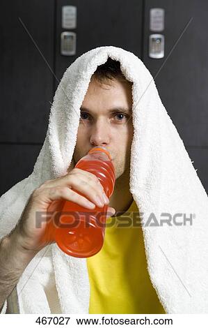 Close up of a man resting in a locker room View Large Photo Image Stock Photo - Close up of a man resting in a locker room. Fotosearch