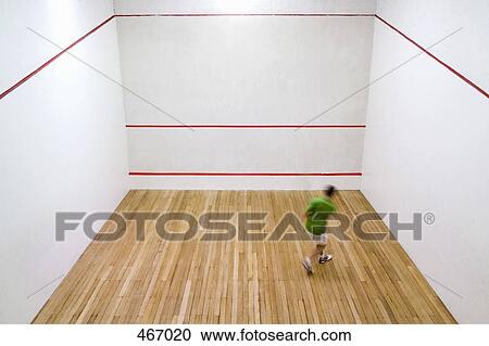 High angle view of a man practicing squash View Large Photo Image Stock Image - High angle view of a man practicing squash. Fotosearch