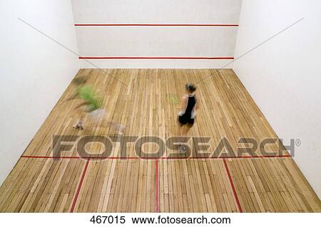 High angle view of two people playing squash View Large Photo Image Stock Photography - High angle view of two people playing squash. Fotosearch