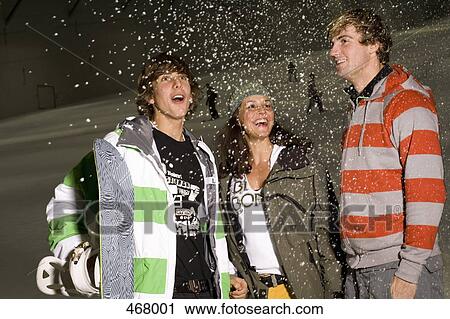Three friends standing on a ski slope with snowboarding equipment View Large Photo Image Stock Image - Three friends standing on a ski slope with snowboarding equipment. Fotosearch