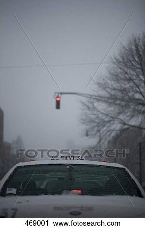Rear view of a taxi stopped at a red traffic light View Large Photo Image Stock Image - Rear view of a taxi stopped at a red traffic light. Fotosearch