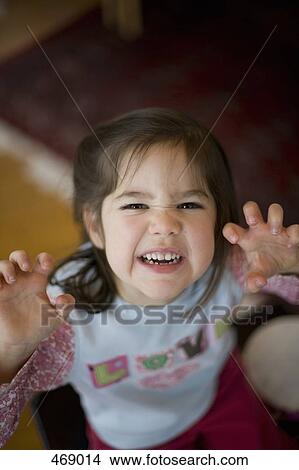 Young girl making a scary face View Large Photo Image Picture - Young girl making a scary face. Fotosearch