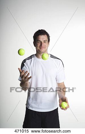 A man juggling with tennis balls View Large Photo Image Stock Photography - A man juggling with tennis balls. Fotosearch