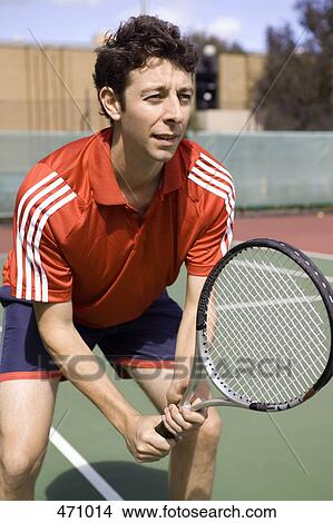 A man playing tennis View Large Photo Image Picture - A man playing tennis. Fotosearch