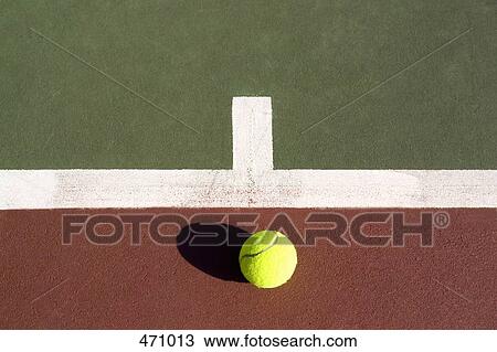 A tennis ball lying on a tennis court View Large Photo Image Stock Image - A tennis ball lying on a tennis court. Fotosearch