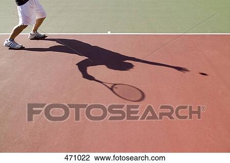 Low section of a tennis player and his shadow View Large Photo Image Stock Image - Low section of a tennis player and his shadow. Fotosearch