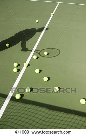 Shadow of a tennis player on the court View Large Photo Image Stock Photo - Shadow of a tennis player on the court. Fotosearch