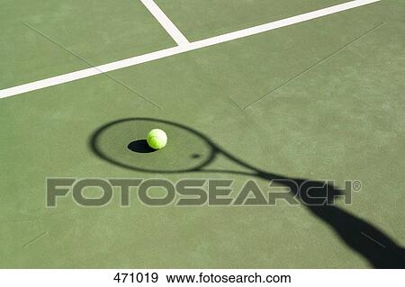 Shadow of a tennis racquet on a tennis court View Large Photo Image Stock Photo - Shadow of a tennis racquet on a tennis court. Fotosearch