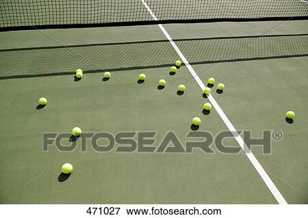 Tennis balls scattered on a tennis court View Large Photo Image Stock Photo - Tennis balls scattered on a tennis court. Fotosearch