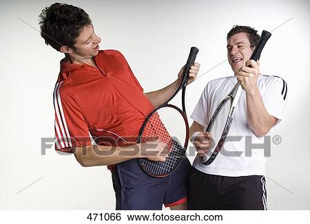 Two tennis players playing air guitar with their racquets View Large Photo Image Stock Photograph - Two tennis players playing air guitar with their racquets. Fotosearch