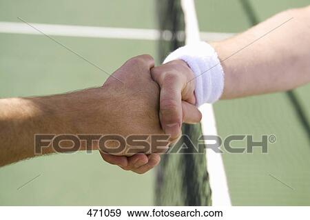 Stock Photo - Two tennis players shaking hands. Fotosearch