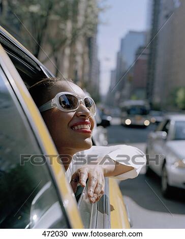 A woman looking out of a taxi window, New York City, USA View Large Photo Image Stock Image - A woman looking out of a taxi window, New York City, USA. Fotosearch