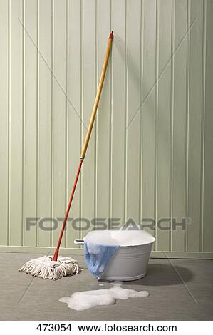 A bucket of soapy water and a mop View Large Photo Image Picture - A bucket of soapy water and a mop. Fotosearch