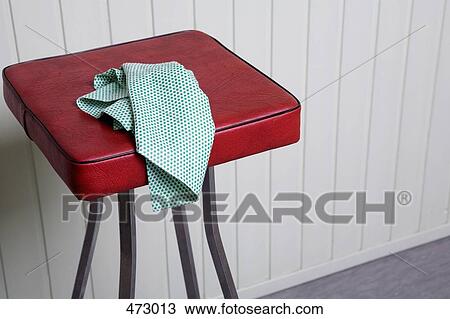 Stock Image - A cleaning cloth on a stool. Fotosearch