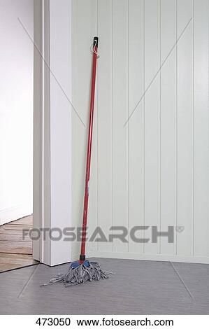 Stock Image - A mop in a corner. Fotosearch