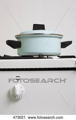 A saucepan on a stove View Large Photo Image Stock Image - A saucepan on a stove. Fotosearch