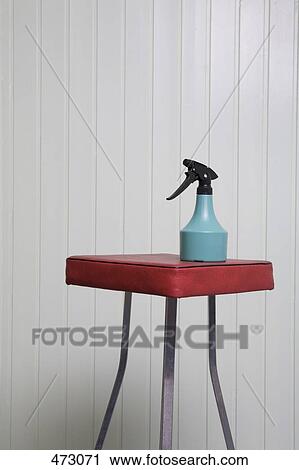 A spray bottle on a stool View Large Photo Image Stock Image - A spray bottle on a stool. Fotosearch