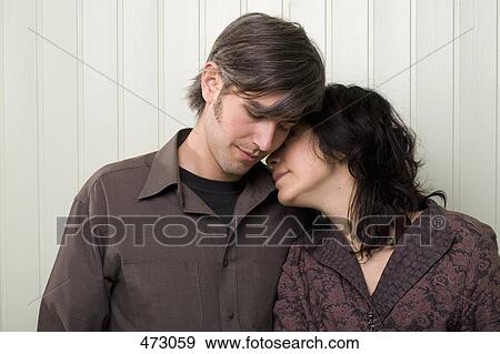 Stock Photo - A young couple embracing. Fotosearch