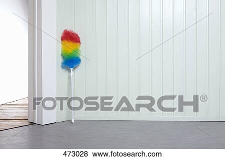 Stock Photo - Multi-colored duster in a corner. Fotosearch
