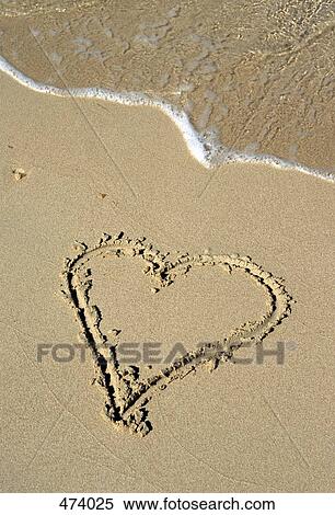 A heart shape drawn in the sand on a beach View Large Photo Image Stock Photography - A heart shape drawn in the sand on a beach. Fotosearch