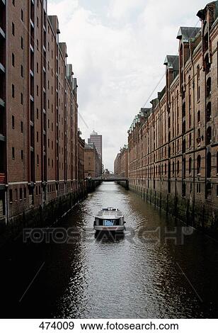 Barge on a canal, Speicherstadt, Hamburg, Germany View Large Photo Image Stock Photo - Barge on a canal, Speicherstadt, Hamburg, Germany. Fotosearch
