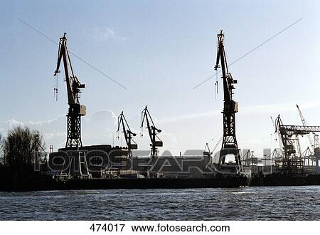 Cranes on a commercial dock View Large Photo Image Stock Photo - Cranes on a commercial dock. Fotosearch