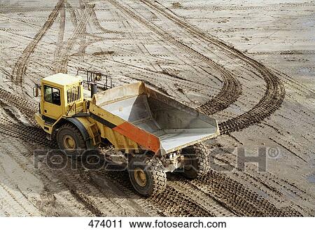 Dump truck on muddy ground View Large Photo Image Stock Image - Dump truck on muddy ground. Fotosearch