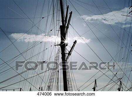 Stock Photograph - Ship's mast and rigging in silhouette. Fotosearch