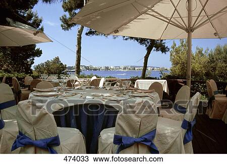 Tables set for a wedding reception View Large Photo Image Stock Image - Tables set for a wedding reception. Fotosearch