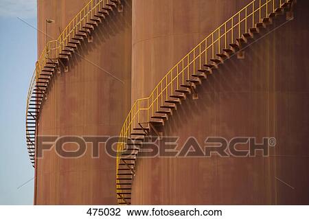 Detail of stairs curving around large storage tanks View Large Photo Image Stock Image - Detail of stairs curving around large storage tanks. Fotosearch