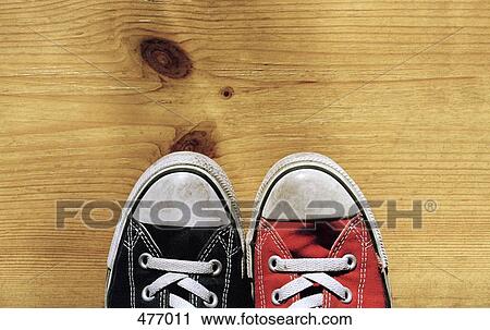 An odd pair of canvas shoes View Large Photo Image Stock Image - An odd pair of canvas shoes. Fotosearch