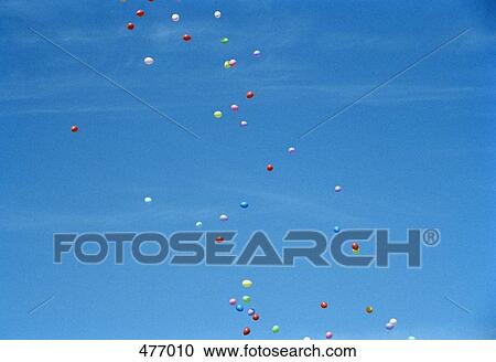 Stock Image - Colored balloons floating in the sky. Fotosearch