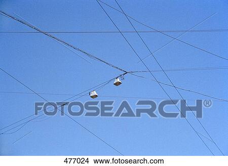 Power lines against a blue sky View Large Photo Image Picture - Power lines against a blue sky. Fotosearch