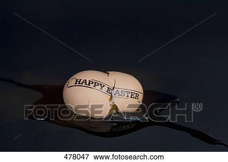 A broken egg stamped 'Happy Easter' View Large Photo Image Stock Photo - A broken egg stamped 'Happy Easter'. Fotosearch