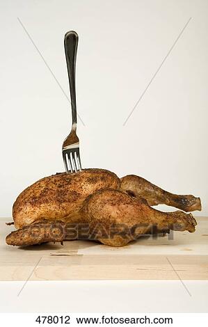 A fork stuck in a roast chicken View Large Photo Image Stock Image - A fork stuck in a roast chicken. Fotosearch