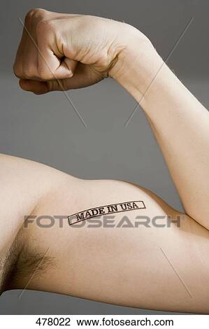 A man flexing his bicep stamped View Large Photo Image Stock Image - A man flexing his bicep stamped. Fotosearch