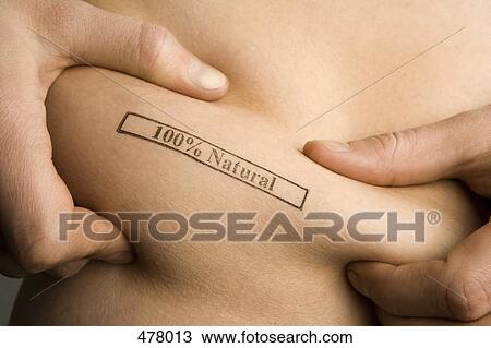 A man pinching part of his abdomen stamped '100% Natural' View Large Photo Image Stock Image - A man pinching part of his abdomen stamped '100% Natural'. Fotosearch